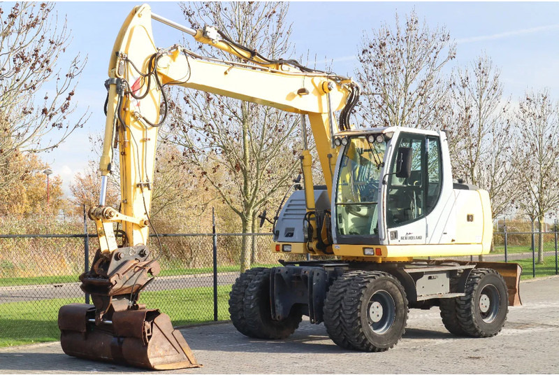 New Holland MH CITY | TILT BUCKET | QUICK COUPLER | DOZER BLADE - Wheel excavator: picture 2 New Holland MH CITY | TILT BUCKET | QUICK COUPLER | DOZER BLADE - Wheel excavator: picture 2