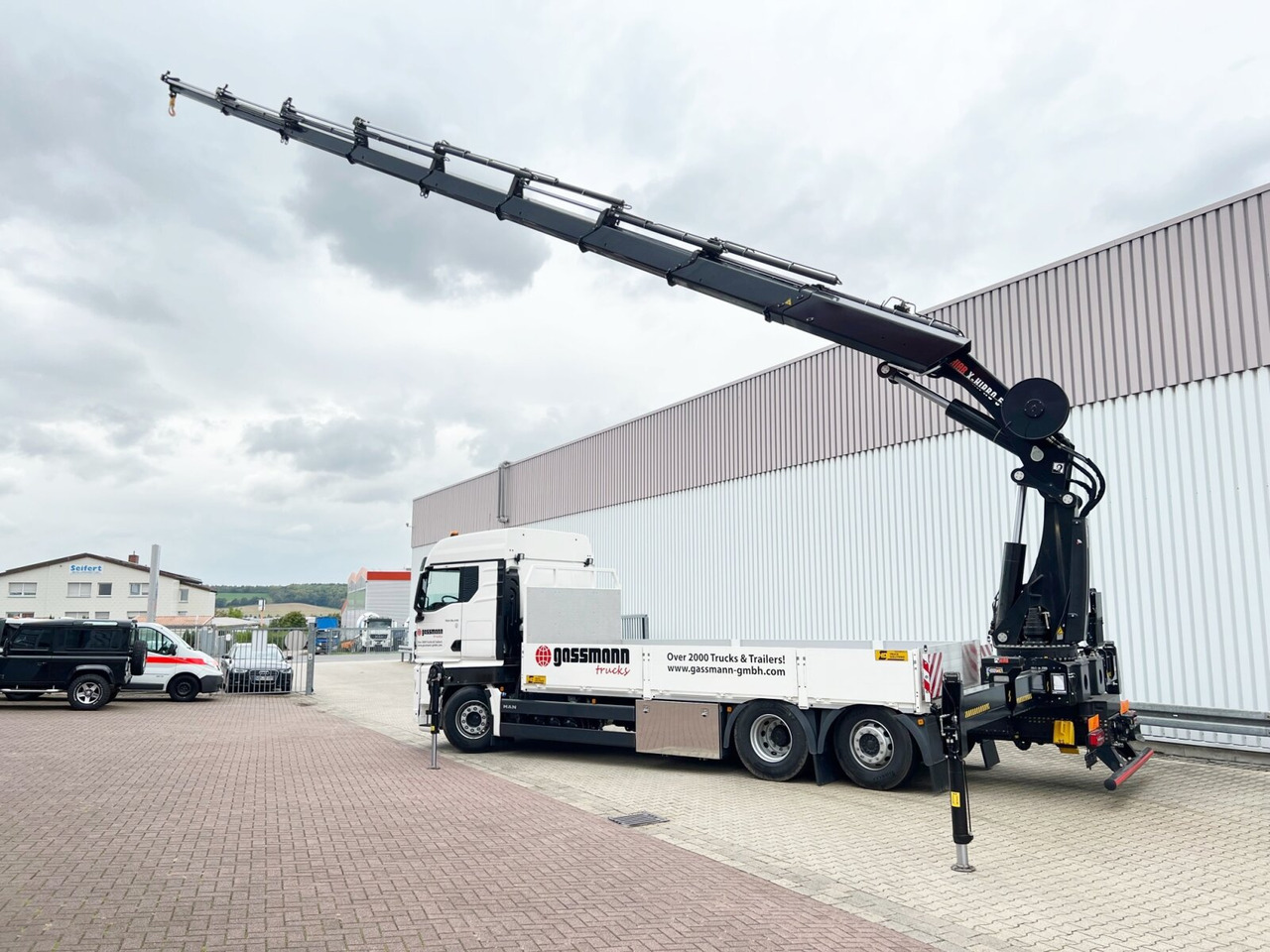 New Crane truck, Dropside/ Flatbed truck MAN TGX 26.510 6x2-4 LL CH TGX 26.510 6x2-4 LL, Kran Hiab X-HiPro 548 E-8, Lenk-/Liftachse, TwistLock 20Fuß, Funk, Retarder: picture 8 New Crane truck, Dropside/ Flatbed truck MAN TGX 26.510 6x2-4 LL CH TGX 26.510 6x2-4 LL, Kran Hiab X-HiPro 548 E-8, Lenk-/Liftachse, TwistLock 20Fuß, Funk, Retarder: picture 8