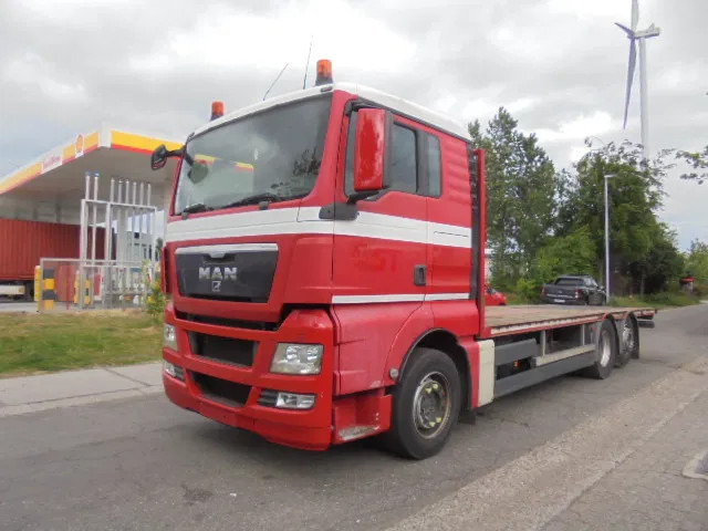 MAN TGX 26.440 6X2 GESTUURDE AS - Dropside/ Flatbed truck: picture 1 MAN TGX 26.440 6X2 GESTUURDE AS - Dropside/ Flatbed truck: picture 1