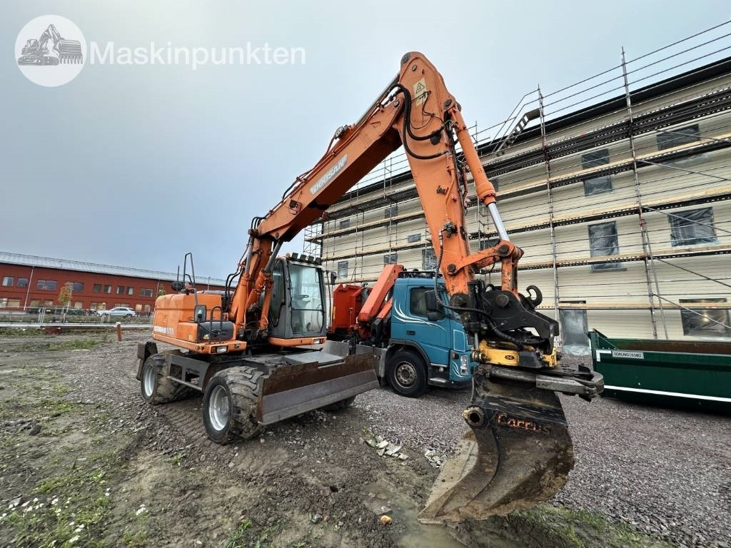Doosan DX 140 W med vagn och redskap - Wheel excavator: picture 2 Doosan DX 140 W med vagn och redskap - Wheel excavator: picture 2