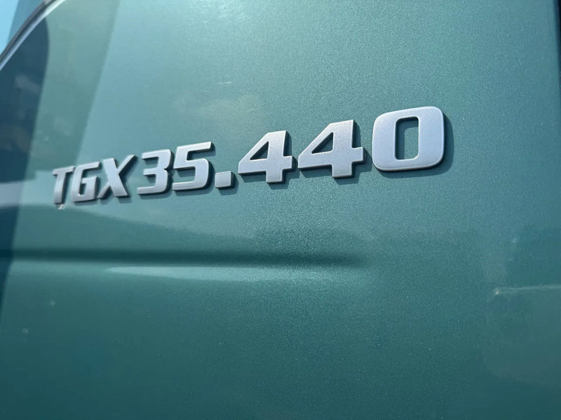 Truck MAN TGX 35.440 8X4 VAKO BANDLOSSER: picture 12